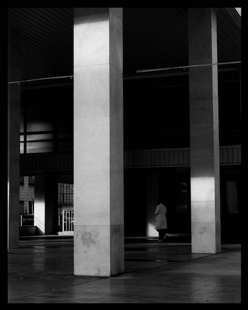 Archtitecture with strong shadow. The building is part of STU in Bratislava. Photo is black and white.